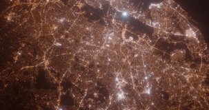 Newark (New Jersey, USA) top view at night. Aerial view on modern city with lights. Camera is flying above the city, moving backward. Vertical video. The north is on the left side