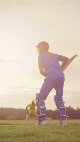 Vertical Screen: Professional Cricket Player Hitting the Ball with a Bat and Starting to Sprint. Athlete Failing the Shot and the Opponent Team Quickly Catching the Ball and Bowling Out the Cricketer