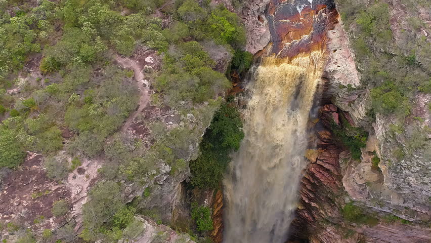 Aerial view of a waterfall and a river in the middle of a big vegetation, Chapada Diamantina, Bahia, Brazil