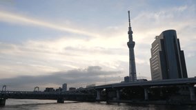 Tokyo, Japan - September 19, 2023: Establishing cinematic shot of Tokyo Sky Tree at cloudy sunrise. Travel video concept.
