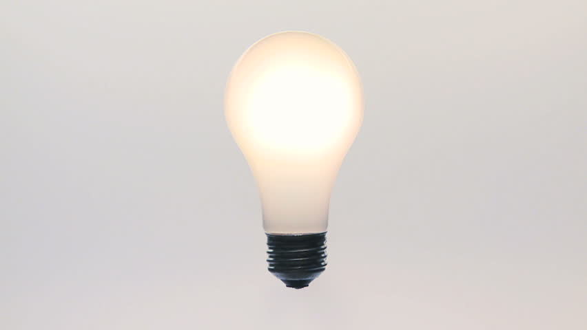 Light bulb fades up and down with white background