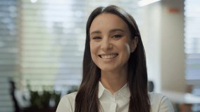 Smiling Caucasian joyful positive girl lady businesswoman indoors looking at camera young business woman pretty face posing alone at home office happy millennial student professional close up portrait - Powered by Shutterstock - Get 15% off with code: PIKWIZARD15