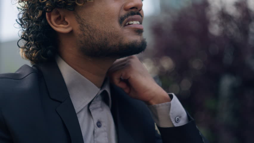 Hispanic businessman suffering unwell dizzy Arabian business man Indian male entrepreneur employer suffer with uncomfortable collar feel stuffiness warm heat hot need cold fresh air in city outdoors