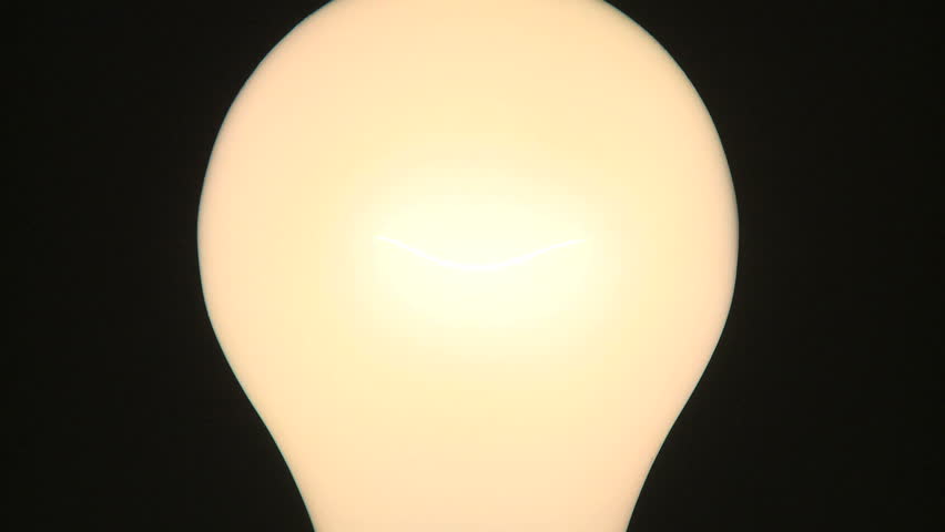 Light bulb fades up from black 
