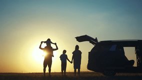 family traveling by car. family watching sunset silhouette next to the car in the park. happy family kid dream concept. people in the park. family car camping resting lifestyle in nature - Powered by Shutterstock - Get 15% off with code: PIKWIZARD15