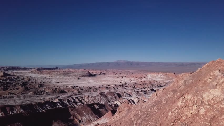 Aerial view of rocky edge in a salt desert of Atacama, Chile.