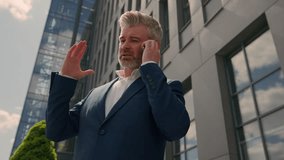 Serious irritated confident emotional entrepreneur talk smartphone conflict explain discussing job problem speaking middle-aged senior business man mature businessman in city talking mobile phone call - Powered by Shutterstock - Get 15% off with code: PIKWIZARD15