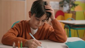 Little school boy primary schoolboy Caucasian son kid child clever smart writing task exercise at class lesson tired failure problem irritated trouble education difficulty hard studying learning study - Powered by Shutterstock - Get 15% off with code: PIKWIZARD15