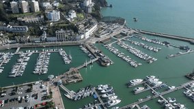 Torquay, Torbay, South Devon, England: DRONE VIEWS: The drone shows moored boats and yachts in Torquay Marina. Torquay is a popular UK holiday resort and a water sports hub (Clip 5).