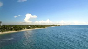 Miami beach with clear blue water and fluffy clouds in the sky, sunny day, aerial view, in America