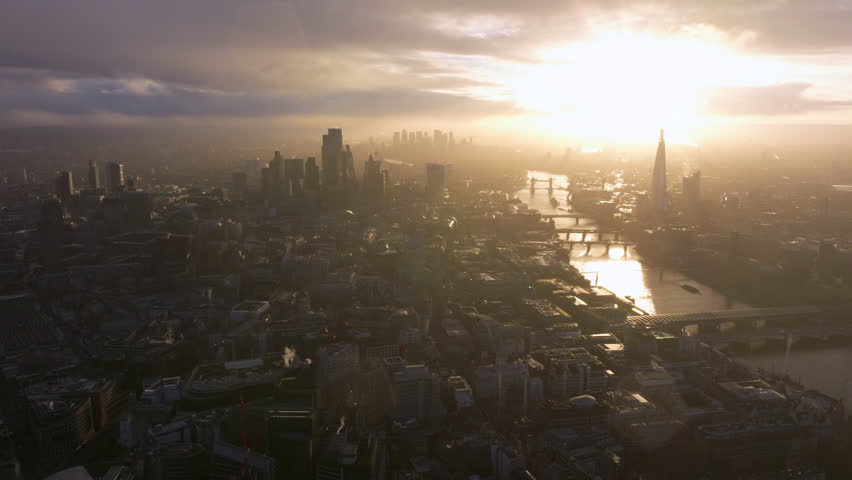 High aerial slider shot of the city of London at sunrise