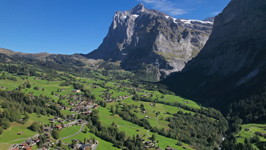 Aerial view of Grindelwald mountain village, Bernese Oberland, Switzerland. 2.5x speeded up from 24 fps. Royalty-Free Stock Footage #3454869035