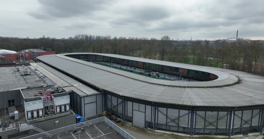 Artificial ice skating arena, recreational winter activity, outdoor architecture aerial drone overview. Utrecht, The Netherlands. Winter sports work out complex facility.