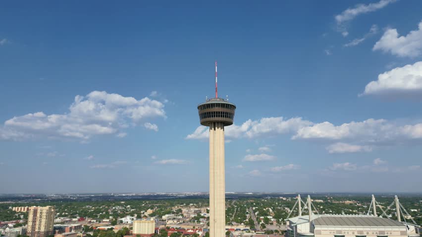 Tilt-down aerial view of the recognisable Tower of Americas structure in San Antonio, Texas