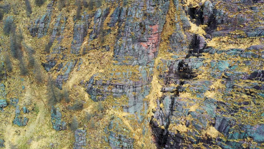 Colorful rock strata with intricate patterns, nature's artistry on display, aerial view Royalty-Free Stock Footage #3454906411