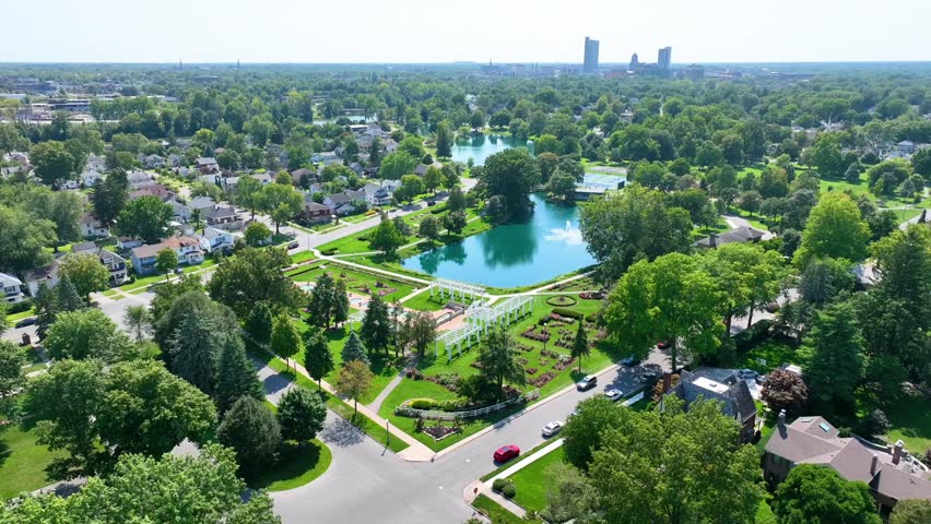 Aerial View of Lakeside Park with Fountain in Fort Wayne - Fly Over Shot