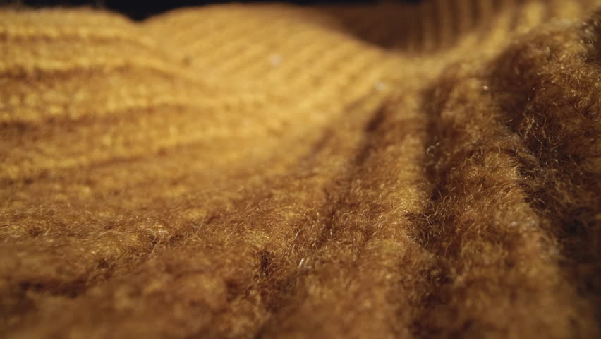 Macro shot of woollen fabric. Slider dolly extreme close-up of clothing material fabric texture. Woollens, wool fibers. Warm winter clothing. Shot with laowa 24mm probe lens Royalty-Free Stock Footage #3455008543
