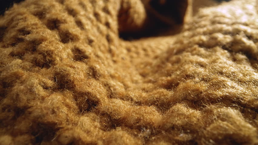Macro shot of woollen fabric. Slider dolly extreme close-up of clothing material fabric texture. Woollens, wool fibers. Warm winter clothing. Shot with laowa 24mm probe lens Royalty-Free Stock Footage #3455008643