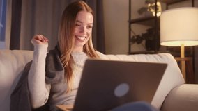 Portrait of pretty young woman having video call conference meeting by laptop computer at home Smiling blond female talking on personal conversation at night indoors Distance relationship concept - Powered by Shutterstock - Get 15% off with code: PIKWIZARD15