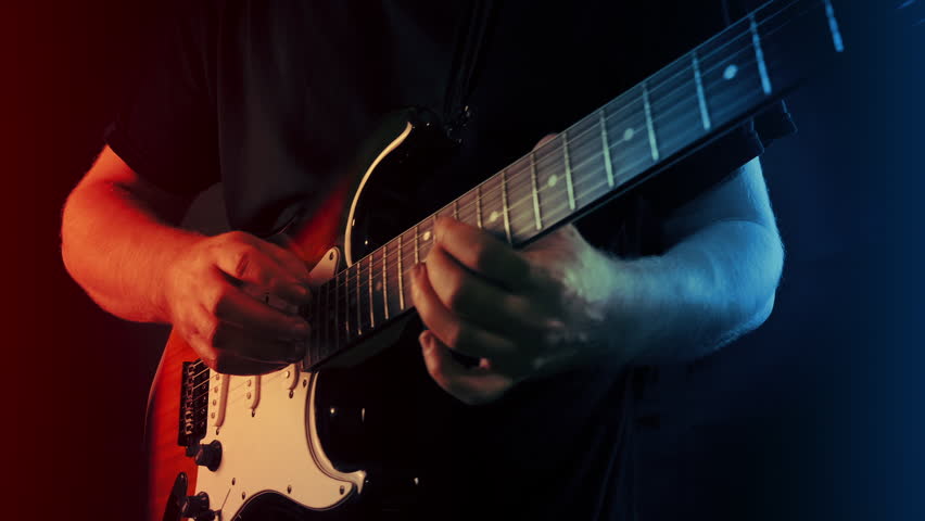 Guitarist Finger Taps Skillful Musician Plays On Stage