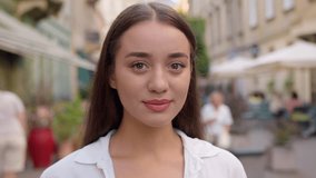 Close up portrait gorgeous Caucasian young woman smiling looking at camera cute girl happy European elegance lady city gen z outdoors holiday peaceful pleasure enjoy weekend wellness satisfied model - Powered by Shutterstock - Get 15% off with code: PIKWIZARD15