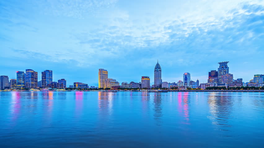 Time-lapse shot of urban commercial buildings skyline in Shanghai at night