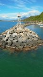 Vertical aerial video capturing the standalone lighthouse on the shores of Puerto Vicente Guerrero