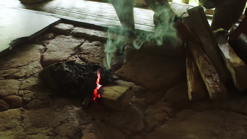 Ecuadorian rainforest indigenous hearth with fire.