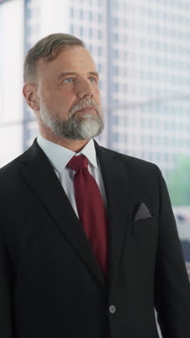 Vertical Screen: Adult Male in a Suit, United States Elections Candidate, Posing for Camera, Smiling. Caucasian Senior Man Standing in a Modern Polling Station with American Flag in the Background