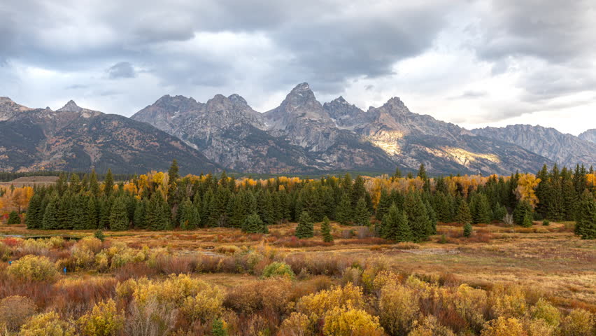 Clouds Soaring Above Teton Range In Autumn. Grand Teton National Park In Wyoming, USA. timelapse