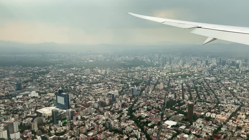 Aerial view of Mexico City, Mexico, during a flight heading MEX international airport. The skyscrapers of Paseo de La Reforma avenue and Chapultepec Park, left, are seen in the background.