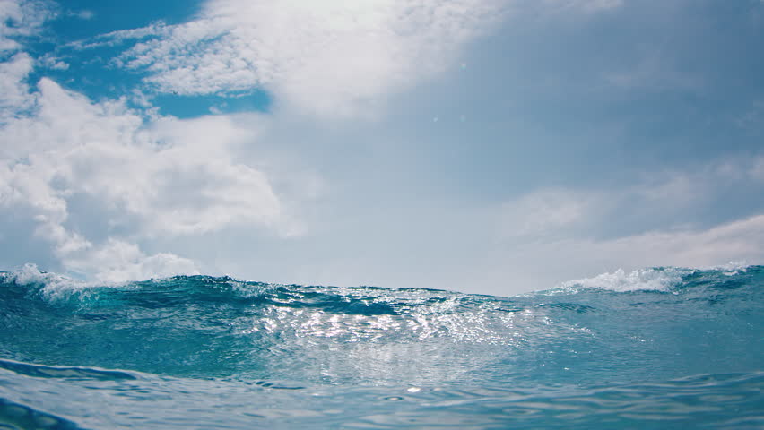 Ocean wave breaks on the camera
