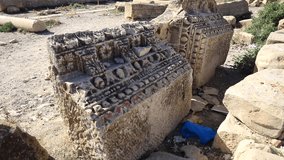Roman Carvings On Stone In Ancient Town Of Sufetula (Sbeitla) In Tunisia. high angle, pan right - Powered by Shutterstock - Get 15% off with code: PIKWIZARD15