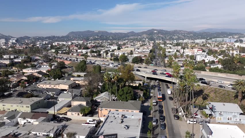 East Hollywood, Los Angeles, Drone Shot of US-101 Highway Traffic, Buildings and Griffith Observatory