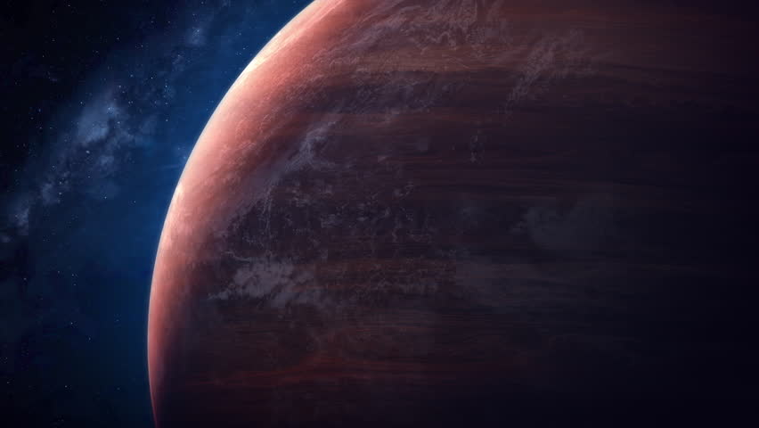 Huge red planet rotates in space. A close-up view of the globe.