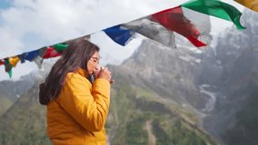 Tourist young woman take sip of hot tea and looking at view during summer camping in Mountains in Lahaul, Himachal Pradesh, India. Girl enjoying relaxation time in nature and feeling fresh air. - Powered by Shutterstock - Get 15% off with code: PIKWIZARD15