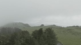 Rural landscape on day with low clouds, Jaizkibel, Spanish Pyrenees, Spain. Aerial drone panoramic view