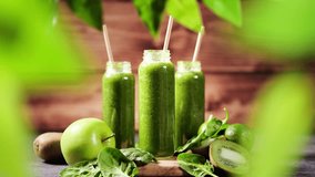 Green smoothie made from fresh raw fruits and vegetables, stock video footage 4k - Powered by Shutterstock - Get 15% off with code: PIKWIZARD15