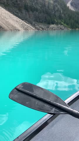 View from canoe and around the area of Moraine Lake and Rocky Mountains in Banff Alberta Canada