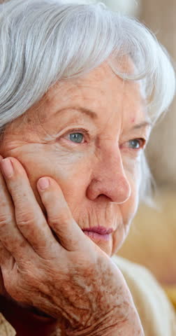 Face, grandma and senior feeling sad, lonely and depression in nursing home for illness of Alzheimer. Closeup, old woman and female person unhappy for retirement in hospice, sick and thinking Royalty-Free Stock Footage #3455657995
