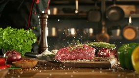 Close-up of falling salt on tasty beef steak in kitchen, super slow motion, filmed on high speed cinematic camera at 1000 fps. Camera movement. - Powered by Shutterstock - Get 15% off with code: PIKWIZARD15