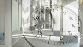 Animation of clock with fast moving hands over caucasian businessman walking, talking on smartphone. Time, connection, business, processing and communication, digitally generated video.