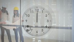Animation of clock with fast moving hands over diverse architects studying blueprints. Time, connection, design, architecture, teamwork and communication, digitally generated video. - Powered by Shutterstock - Get 15% off with code: PIKWIZARD15