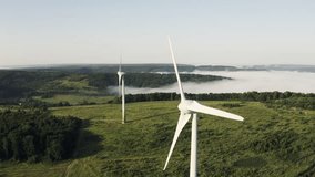Wind Turbines Overlooking Misty Valley at Sunrise in Drone Retreat