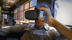 Animation of communication media icons over caucasian casual businessman using vr headset. Connection, business, virtual reality, digital interface and communication, digitally generated video. - Powered by Shutterstock - Get 15% off with code: PIKWIZARD15