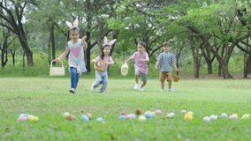 Children having fun in park, Kids holding baskets in their hands Then run in a race to hunt for eggs that fall into the grass. Put it in your basket, the concept of family fun at Easter, slow motion - Powered by Shutterstock - Get 15% off with code: PIKWIZARD15