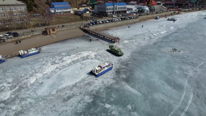 A hovercraft transports tourists across the ice of Lake Baikal. 
