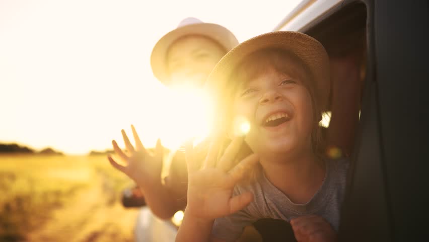 group of children travels by car. travel family vacation summer adventure by car concept. group of children in an open car rides in park. family travel by car sun concept Royalty-Free Stock Footage #3456022381