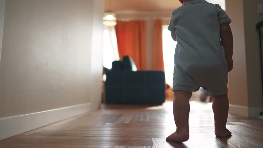 baby runs to his parents for first steps. happy family child - dream concept. little son takes his first steps towards his family at the window of the house. Cute baby learning to walk lifestyle Royalty-Free Stock Footage #3456072203