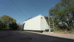 The video a mobile data center housed in a container, filled with servers, signifying a constant flow of data. - Powered by Shutterstock - Get 15% off with code: PIKWIZARD15